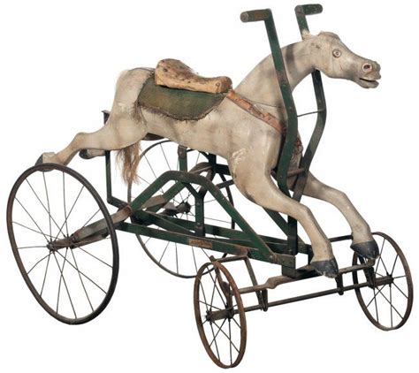 wooden horse mounted on a metal rolling chassis|Horse On Wheels .